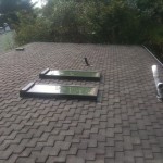 Roof cleaning and roof repair before and after photo of the day. Roof leak repairs as well as a pristine new looking roof!