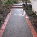 Get that moss and algae off so its not so slippery with pressure washing.  Over 20 years experience in ground washing.